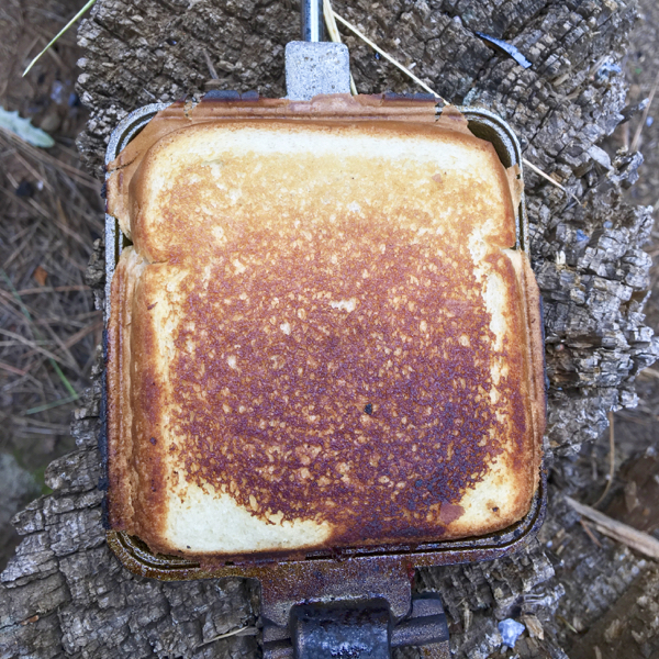 https://diythrill.com/wp-content/uploads/2019/03/Campfire-Pizza-Pie-Toasted.jpg
